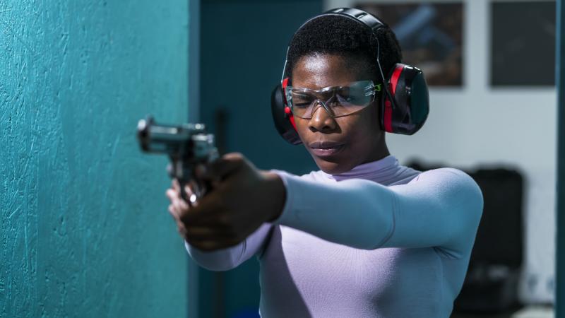 Black woman, shooting range, stock photo