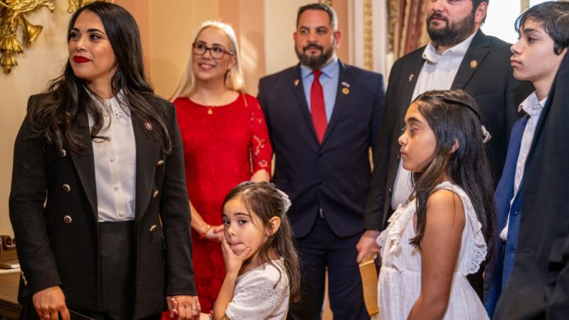 Congresswoman-elect Mayra Flores (R-TX) stands with her family after being sworn-in by Speaker of the House Nancy Pelosi (D-CA) on June 21, 2022 in Washington, DC
