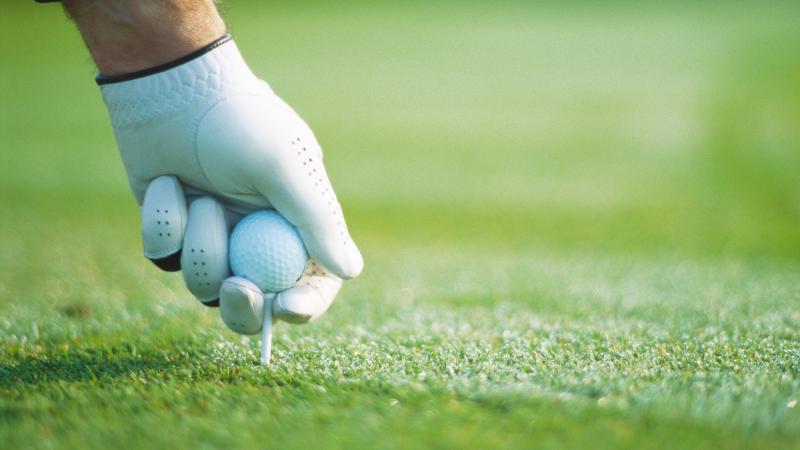 Golf, teeing up, stock photo