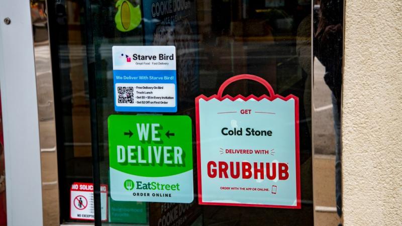 A GrubHub advertisement on a restaurant door