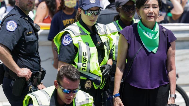 U.S. Rep. Judy Chu (D-CA) is detained by U.S. Capitol Police as she is removed with abortion rights activists as they protest outside the U.S. Supreme Court on the last day of their term on June 30, 2022 in Washington, DC