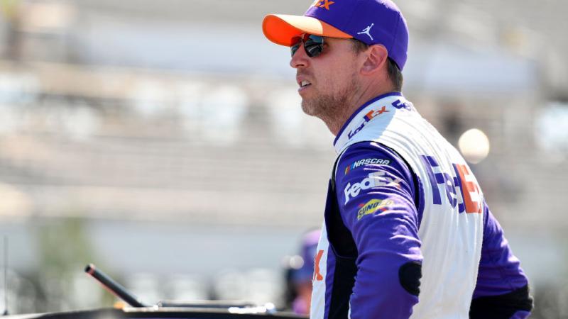 Denny Hamlin sits by car