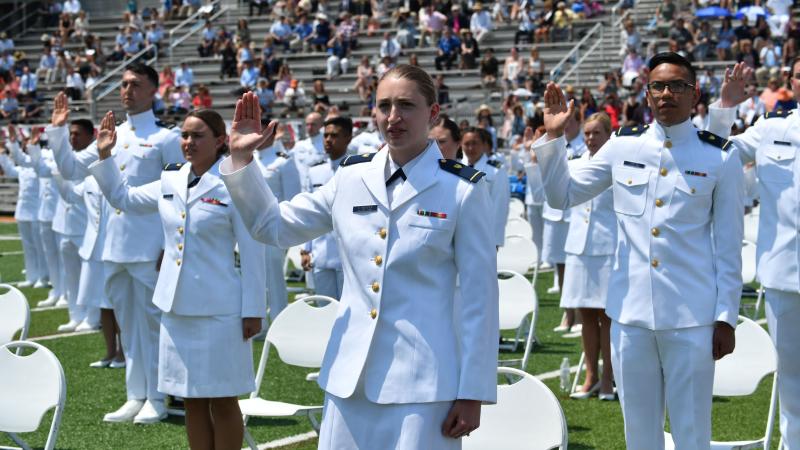 Cadets stand during the US Coast Guard Academys 140th commencement on May 19, 2021 in New London, Connecticut.