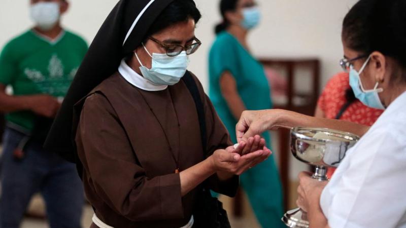 A nun receives the Eucharist at Matagalpa Cathedral, Aug. 19