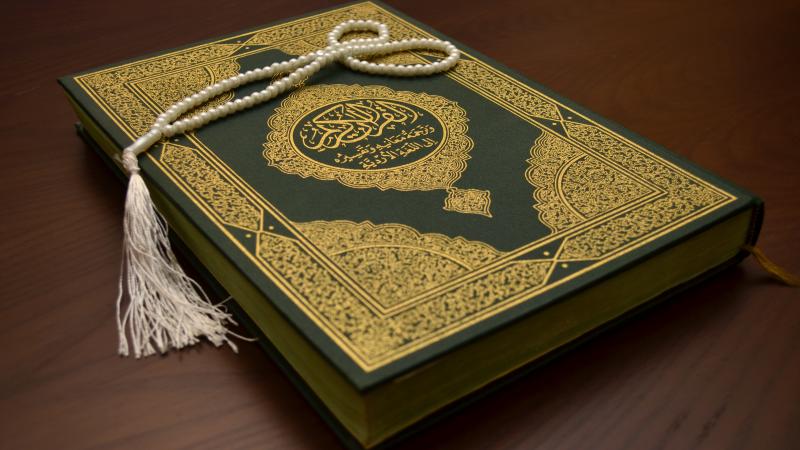 Quran on wooden table
