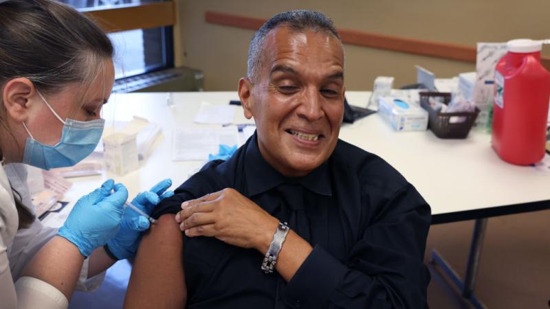 A Chicago resident receives a booster shot, Sept. 2022
