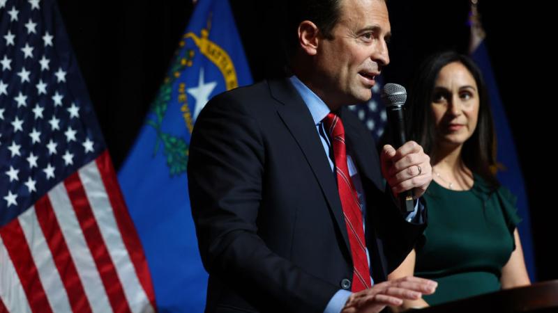 Republican Senate candidate Adam Laxalt with wife Jamie, Nov. 8