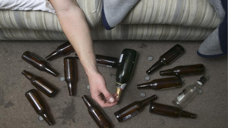 Drunk man, beer bottles, party