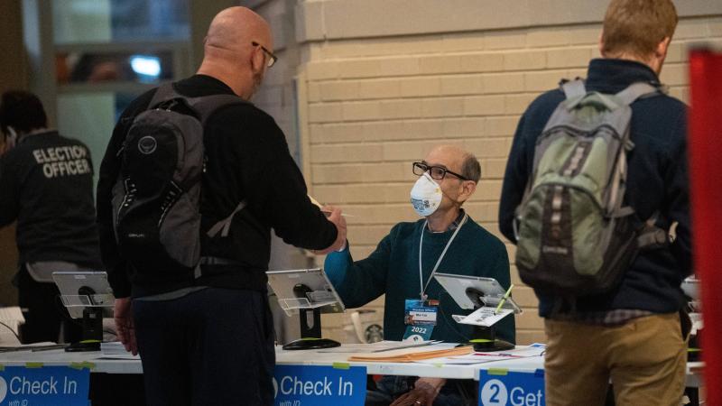 Voters check in during the U.S. midterm elections at a polling station in Arlington, Virginia, the United States, Nov. 8, 2022.