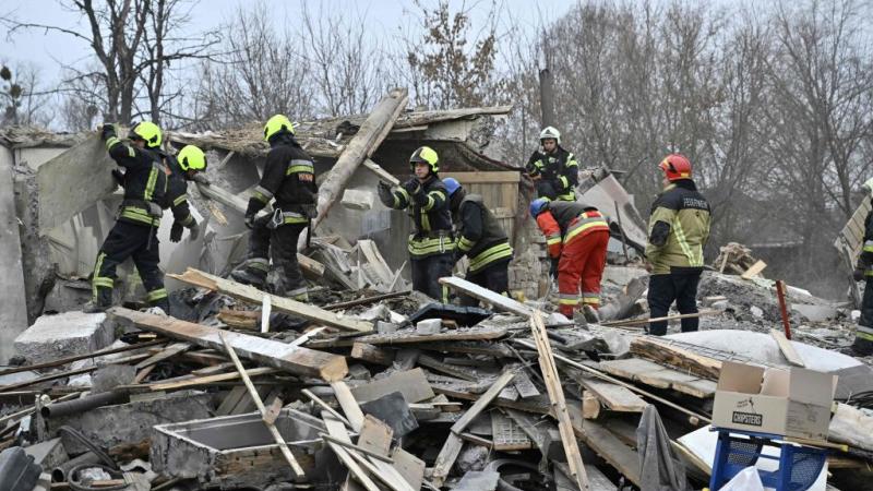 Rescuers clear missile debris, Kyiv, Ukraine, Dec. 29, 2022