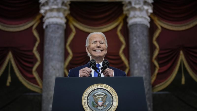 Biden speaks from podium 