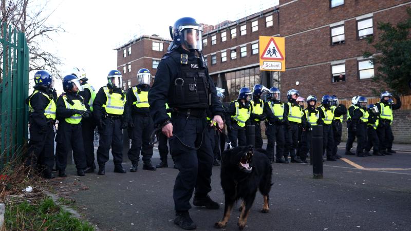 Police with a dog are seen outside the stadium prior to the Premier League match between Tottenham Hotspur and Arsenal FC at Tottenham Hotspur Stadium on January 15, 2023 in London, England.