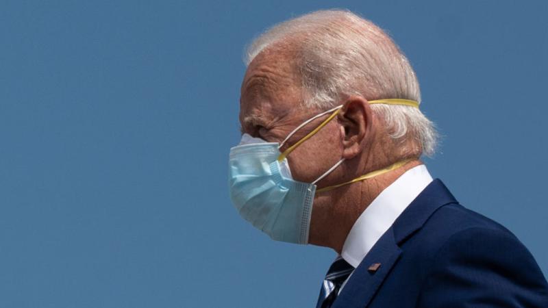 President Biden wears two masks