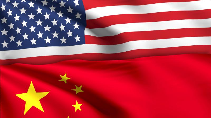 China's flag next to US Flag