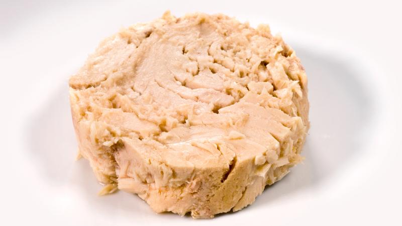 A can-shaped lump of tuna