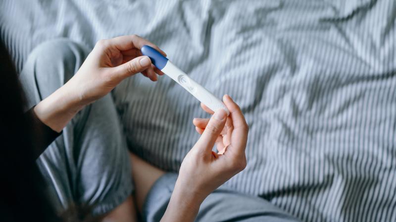 Woman, pregnancy test, stock photo