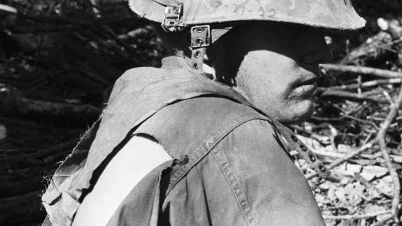 DAK TO, S. VIETNAM-11/27/67-: A grim inscription--"Hill 875, The Smell of Death, Nov. 20-21-22"--on the side of this GI's helmet tells eloquently of the taking of the strategic hill 875 near Dak To. Almost 300 American soldiers reportedly died in storming the position which was taken after a deadly 3-day battle.
