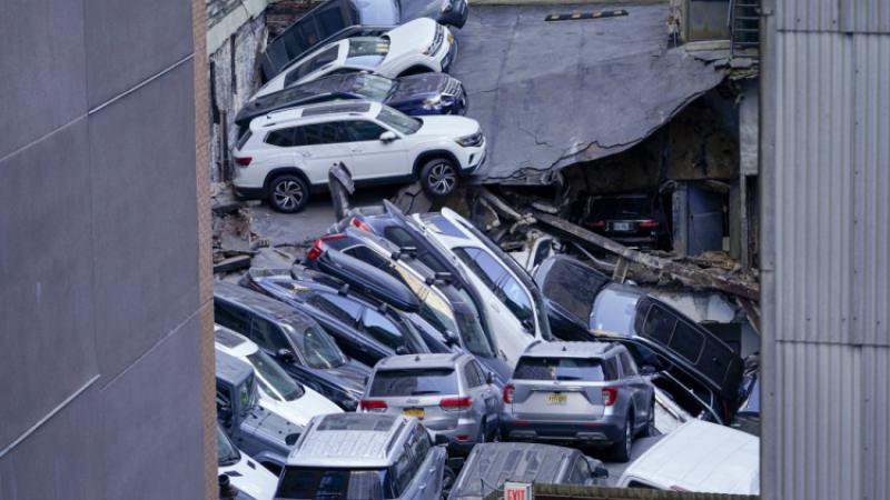 Cars are seen piled on top of one another amid a NYC garage collapse