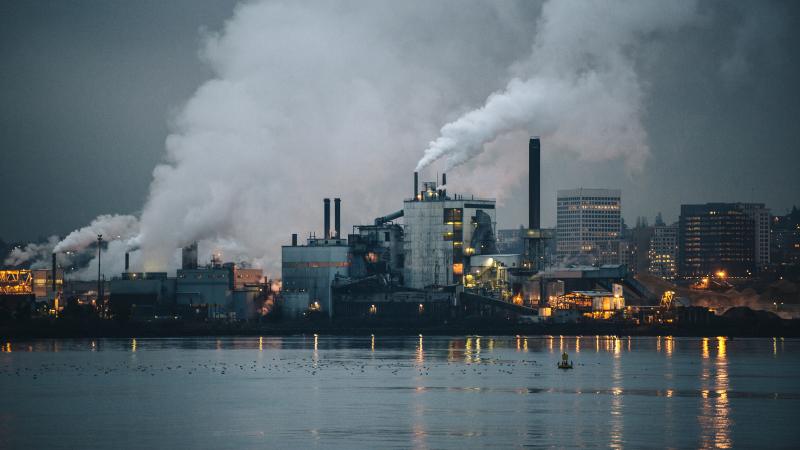 View of industrial plant and smoke stacks at night, Tacoma, Washington, USA 