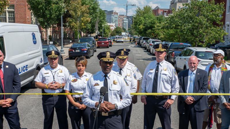 Washington D.C. police speaking at a crime scene. 