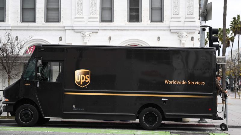 UPS driver making delivery