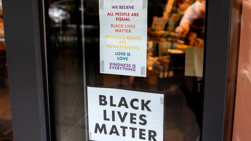 Pride and Black Lives Matter signs are displayed on Paper Source's windows on June 03, 2021 in New York City