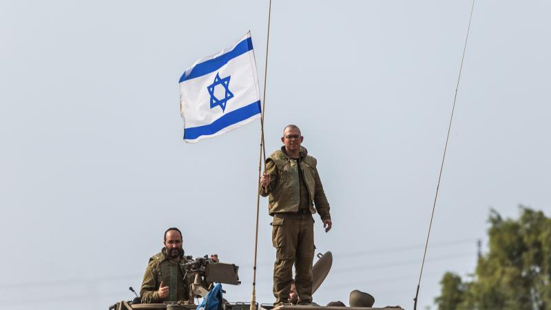Israeli flag, soldier, Sderot, Israel, Oct. 9, 2023