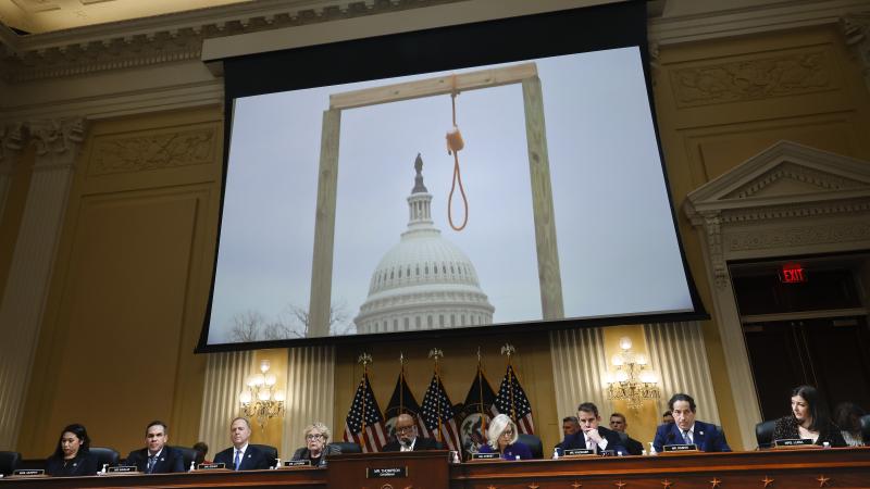 WASHINGTON, DC - DECEMBER 19: An image of a noose and gallows is displayed during the final meeting of the House Select Committee to Investigate the January 6 Attack on the U.S. Capitol, in the Canon House Office Building on Capitol Hill on December 19, 2022 in Washington, DC. The committee is expected to approve its final report and vote on referring charges to the Justice Department. (Photo by Chip Somodevilla/Getty Images)