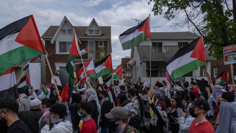 Hundreds of residents of Dearborn, Michigan march through the neighborhoods in Dearborn on May 15, 2021 to protest the actions of the Israeli Army in Gaza 