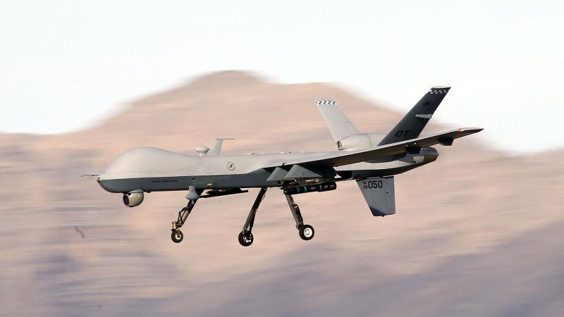 An MQ-9 Reaper remotely piloted aircraft (RPA) flies by during a training mission at Creech Air Force Base on November 17, 2015 in Indian Springs, Nevada