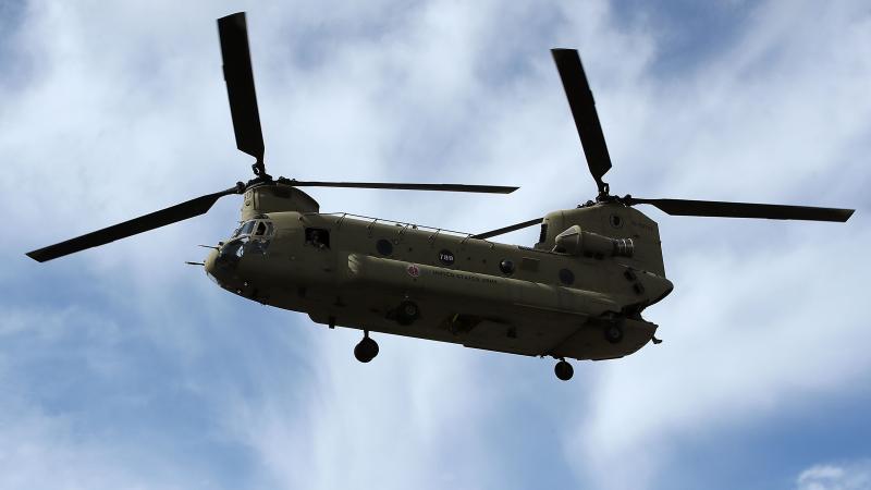 A Illinois National Guard helicopter takes off from a shopping center parking lot after delivering supplies for the Wilmington Hospital, on September 17, 2018 in Wilmington, North Carolina.