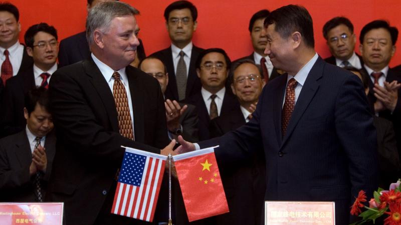 BEIJING, CHINA - JULY 24: Stephen Tritch, president and chief executive of Westinghouse, (L) shakes hands with Wang Binghua, Chairman of the State Nuclear Power Technology Corporation of China (SNPTC), (R) during a signing ceremony to build nuclear power plants at the Great Hall of the People on July 24, 2007 in Beijing, China.