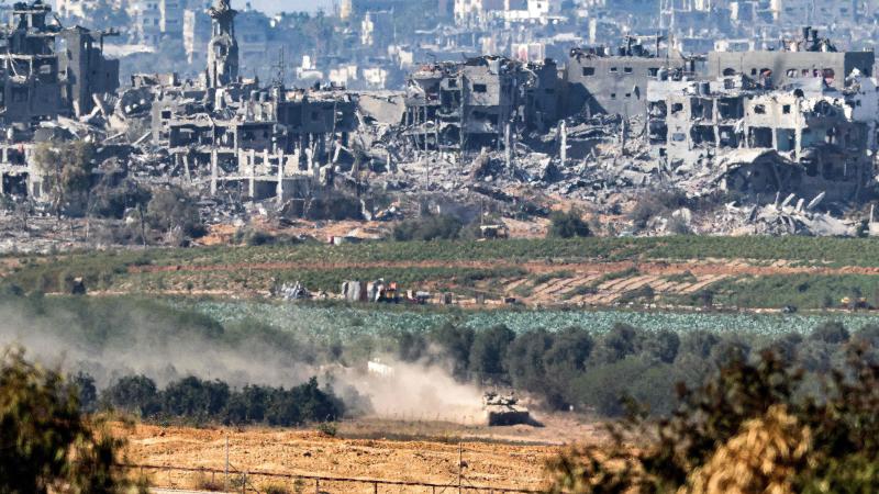 Israeli tank moves into position on the Israel-Gaza border, November 2023.