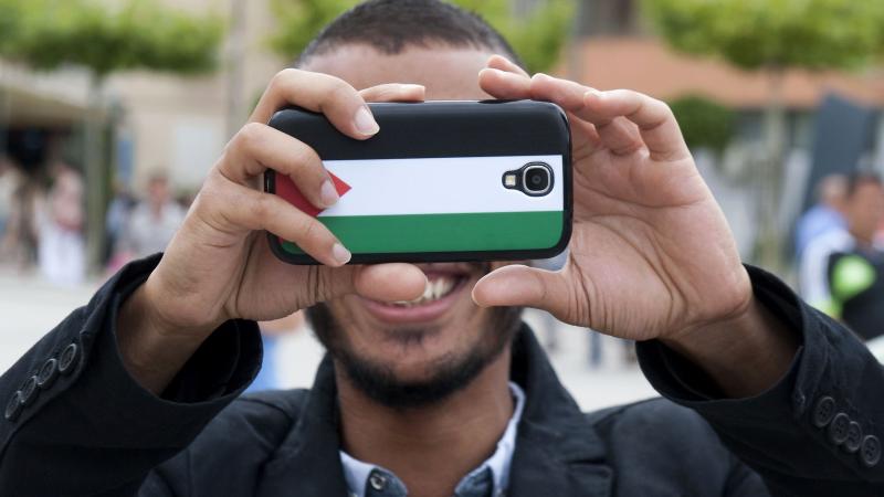Palestinian flag, phone, Aug. 1, 2014, Kosovo