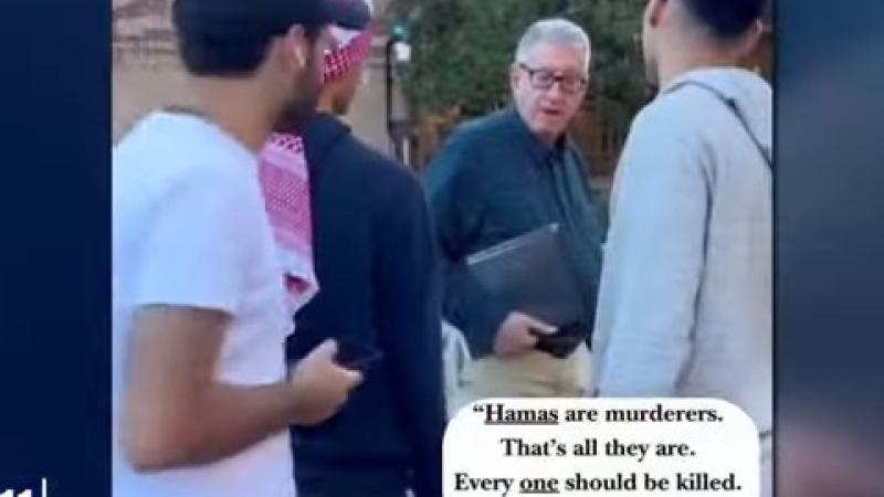 University of Southern California professor John Strauss talks to anti-Israel protesters