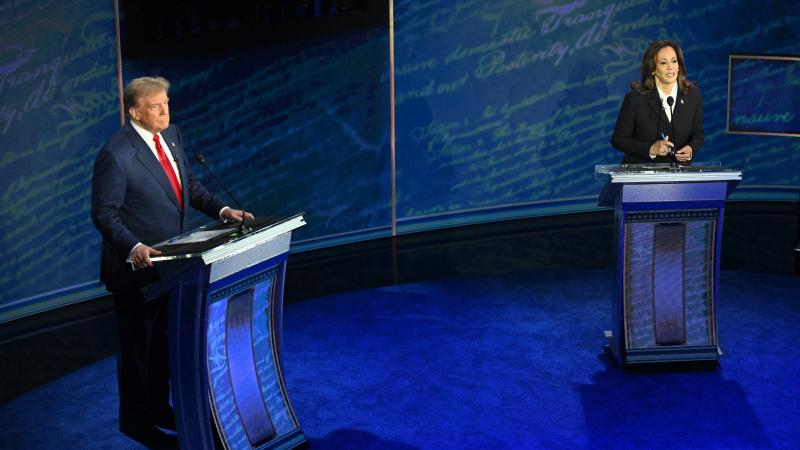 US Vice President and Democratic presidential candidate Kamala Harris and former US President and Republican presidential candidate Donald Trump attend a presidential debate at the National Constitution Center in Philadelphia, Pennsylvania, on September 1