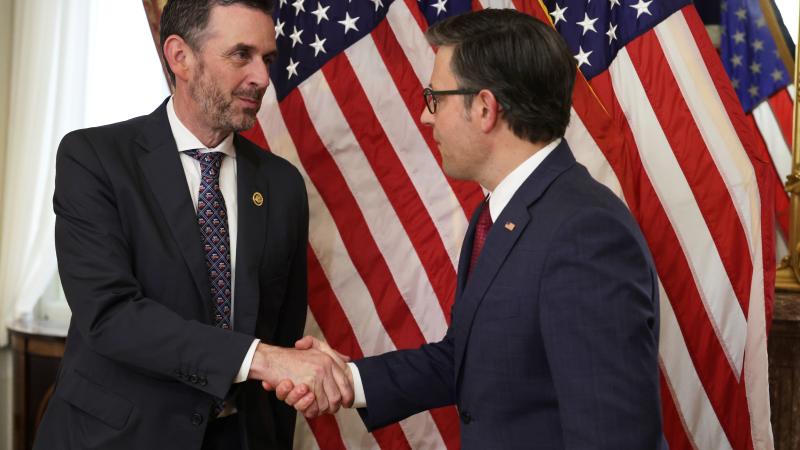 U.S. Speaker of the House Rep. Mike Johnson (R-LA) (R) shakes hands with Rep. Michael Rulli (R-OH) (L) during a ceremonial swearing-in at the U.S. Capitol on June 25, 2024 in Washington, DC. Speaker Johnson held a mock swearing-in for the newest member from Ohio