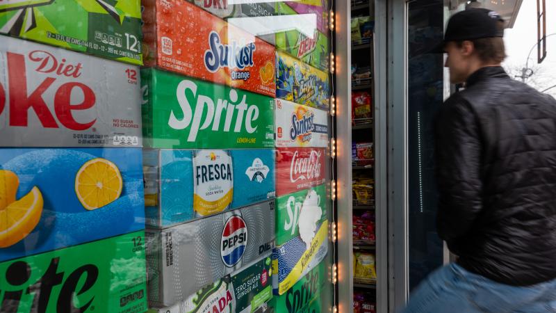 Cases of canned soda are displayed in a window of a deli on February 11, 2025 in New York City.