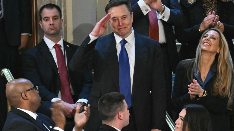 Elon Musk stands as he is recognized by US President Donald Trump during Trump's address to a joint session of Congress at the US Capitol in Washington, DC, on March 4, 2025.