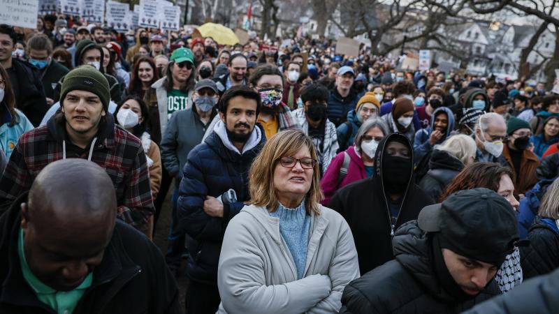 Protesters gather at Powder House Park, during a demonstration opposing the detention of Rumeysa Ozturk, a Turkish national and Tufts University graduate student.