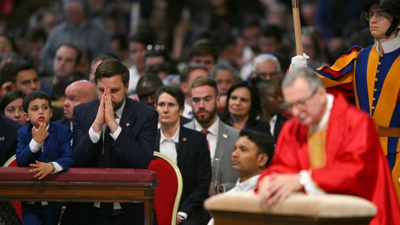 U.S. Vice President JD Vance and his son attend the celebration of the Passion of the Lord on Good Friday as part of the Holy Week, at St Peter's Basilica in the Vatican on April 18, 