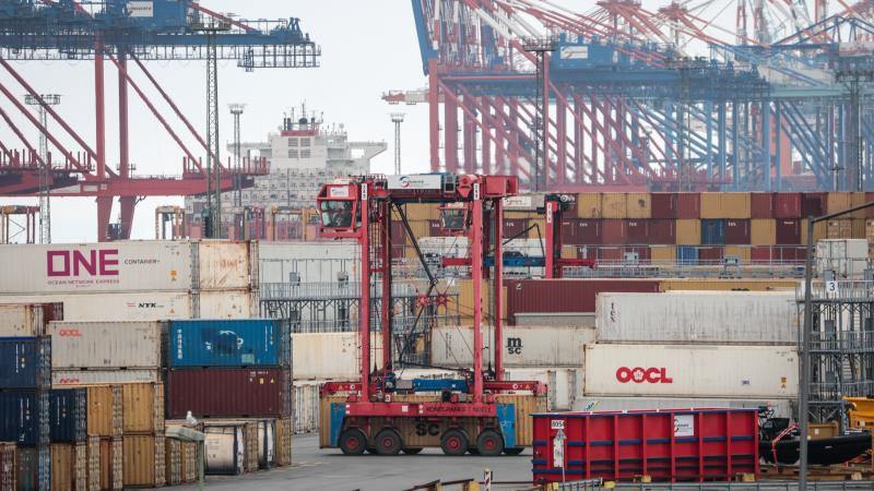 A van carrier of terminal operator Eurogate passes between stacked containers at the container terminal of Bremerhaven port on April 22, 2025 in Bremerhaven, Germany. Industry and logistics are facing continued uncertainty over the tariffs policy of U.S. President Donald Trump. While Trump has imposed a 25% tariff on European cars and auto parts imports, he has also suggested he may rescind these tariffs in some form. He said too he expects to reach a "deal" with the EU over tariffs soon.