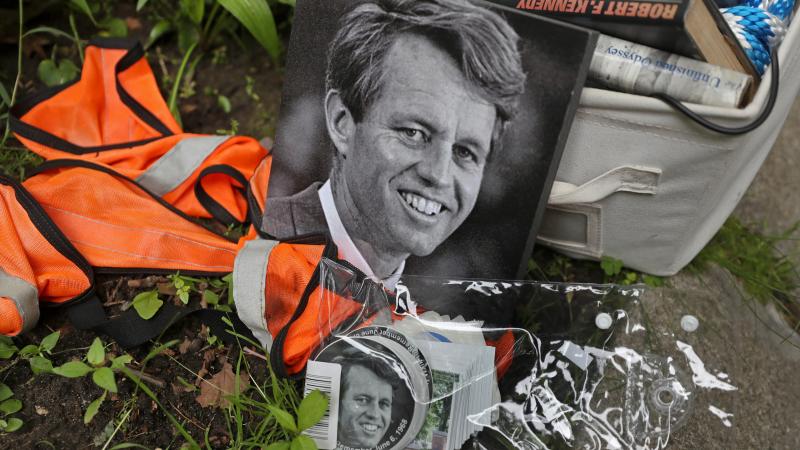 Memorabilia of Robert F. Kennedy rest on the ground at the family home in Brookline, Mass., on June 6, 2018, the 50th anniversary of RFK's assassination