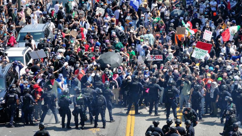 Hundreds of protesters gather to demand an immediate end to Immigration and Customs Enforcement (ICE) workplace raids, as the Trump administration continues its immigration raid operations in California, Los Angeles, United States on June 8, 2025.