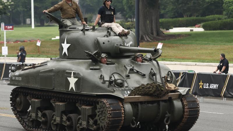 Members of the U.S Army driving in a Sherman tank participate in the 250th birthday parade on June 14, 2025 in Washington, DC.