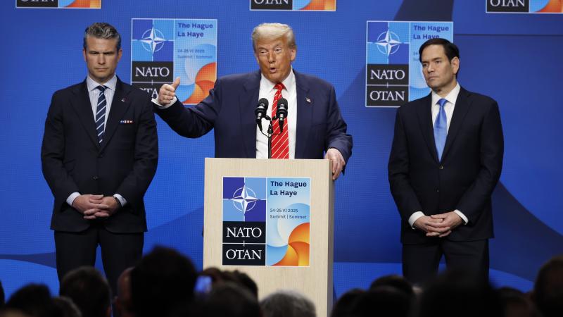 US President Donald Trump, center, during a news conference with Pete Hegseth, US secretary of defense, left, and Marco Rubio, US secretary of state on the second day of the 2025 NATO Summit on June 25, 2025 in The Hague, Netherlands.