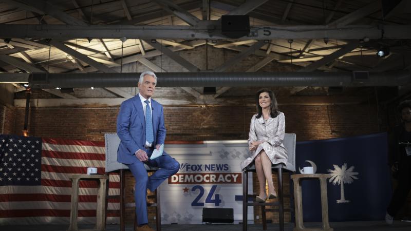 Republican presidential candidate former U.N. Ambassador Nikki Haley speaks with moderator John Roberts
