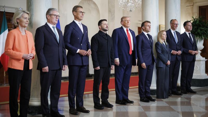 President Donald Trump and Ukraine President Volodymyr Zelensky stand for a Family Photo inside the Cross Hall on August 18, 2025 at The White House