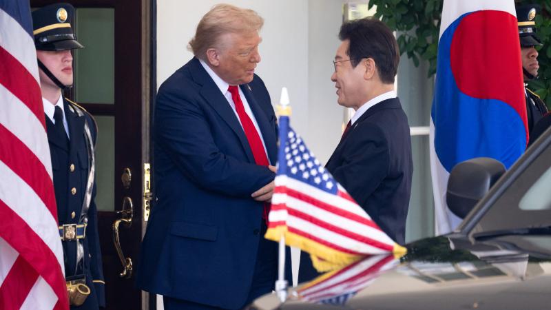 US President Donald Trump greets South Korean President Lee Jae Myung as he arrives at the West Wing entrance of the White House in Washington, DC, on August 25, 2025