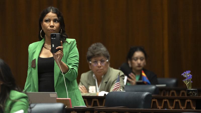 Arizona State Rep. Analise Ortiz films her Republican colleagues during a legislative session at the Arizona House of Representatives on April 17, 2024 in Phoenix, Arizona